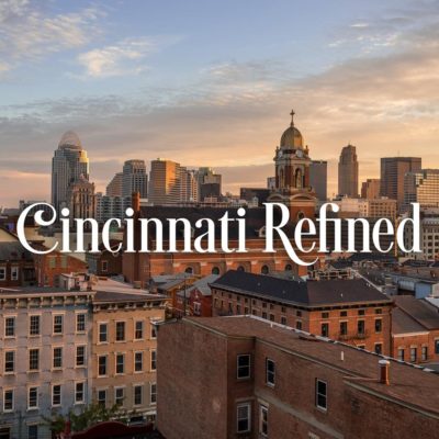 Cincinnati Refined Logo with Cincinnati Skyline in background