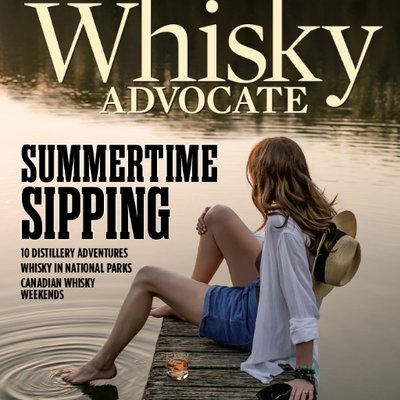 Whiskey Advocate Logo with Girl sitting at Lake Logo
